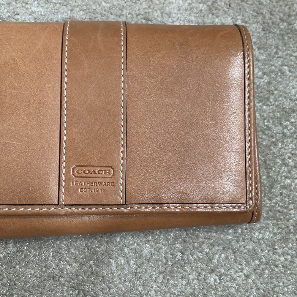 Tan leather Coach wallet.Very good condition. Has interior slots for cards.